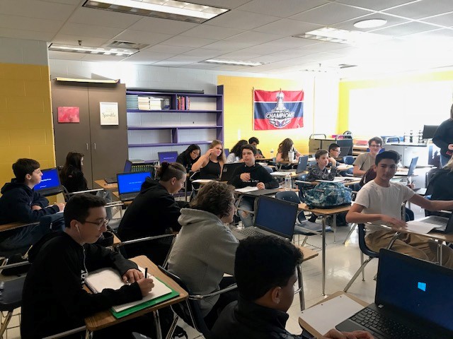 Students in the second block algebra class working against the clock to finish their work.