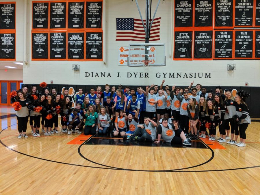Unified basketball team and cheerleader after a game. 