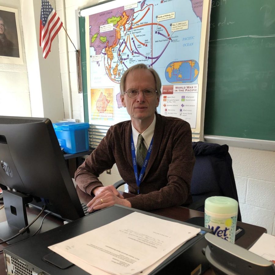 Mr. Wonders, one of BDHS favorite teachers, sits at his desk. 