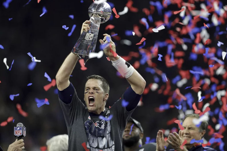 Tom Brady raises the Lombardi Trophy for his sixth time