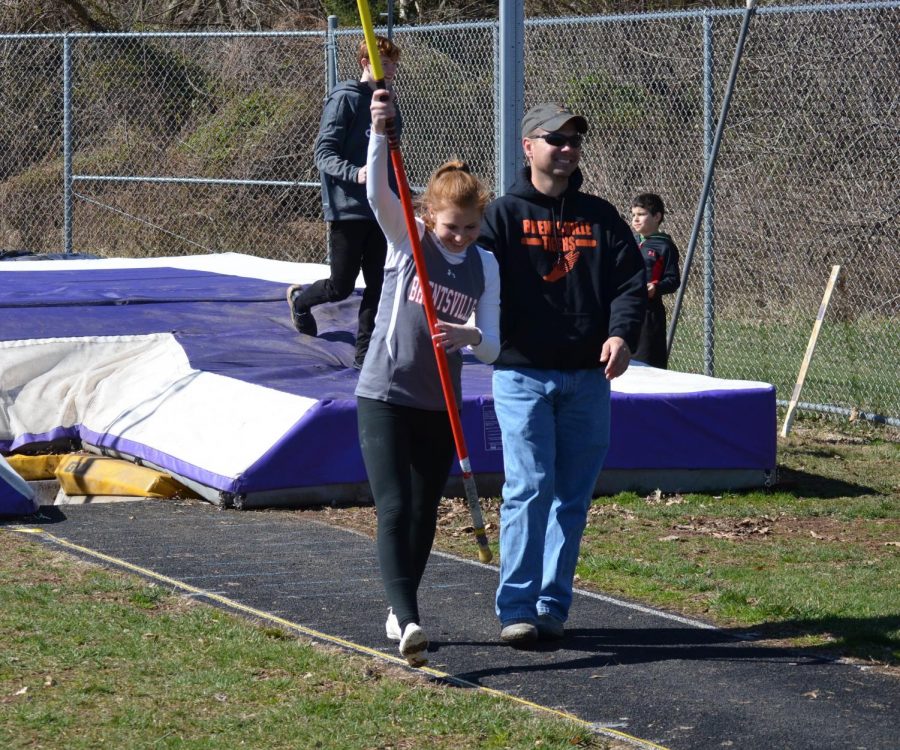 Laney King celebrating a jump with Coach Sucic.