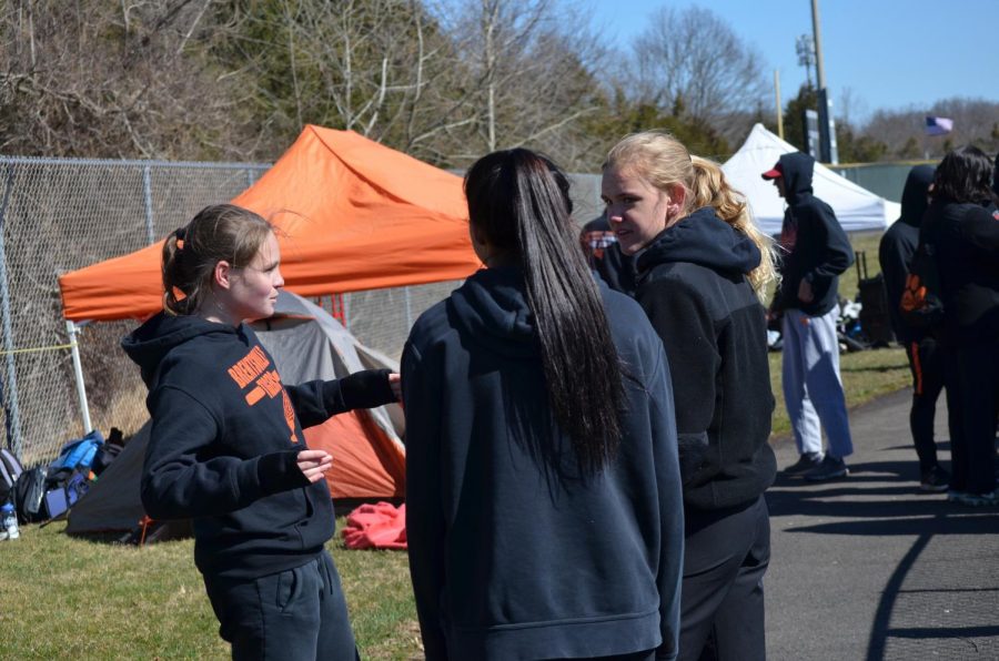 Anna Fleischauer, Juliana Asturias, and Abby Seigel (left to right) chat between races. 