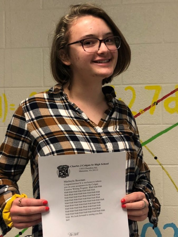 Makayla Bowman holds her acceptance letter to Colgans Fiction Creative Writing Program 