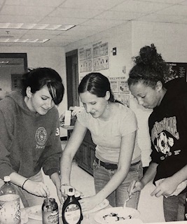 Students making crepes after school at a club.