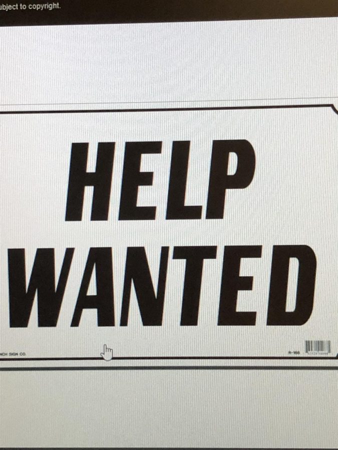 Many businesses have a Help Wanted sign to advertise for their business.