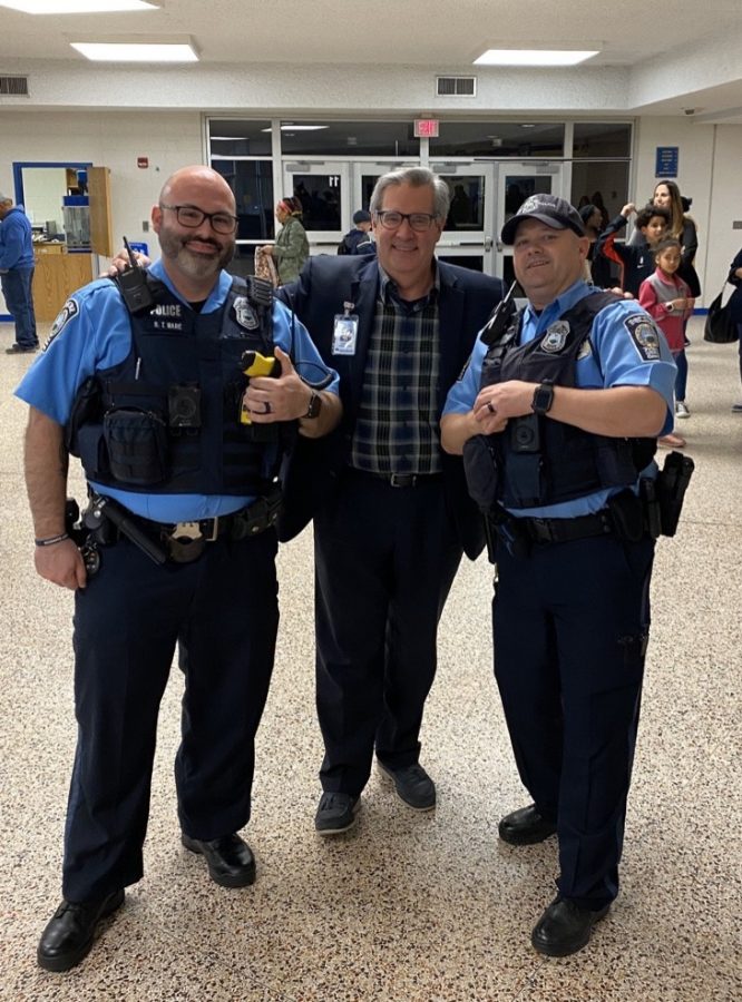Steve Walts, PWCS superintendent, standing with two security officers.